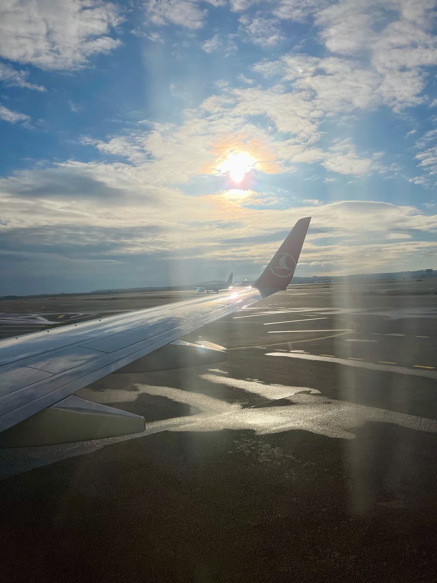 An airplane wing at sunset, the view for many passengers arriving on an Istanbul layover