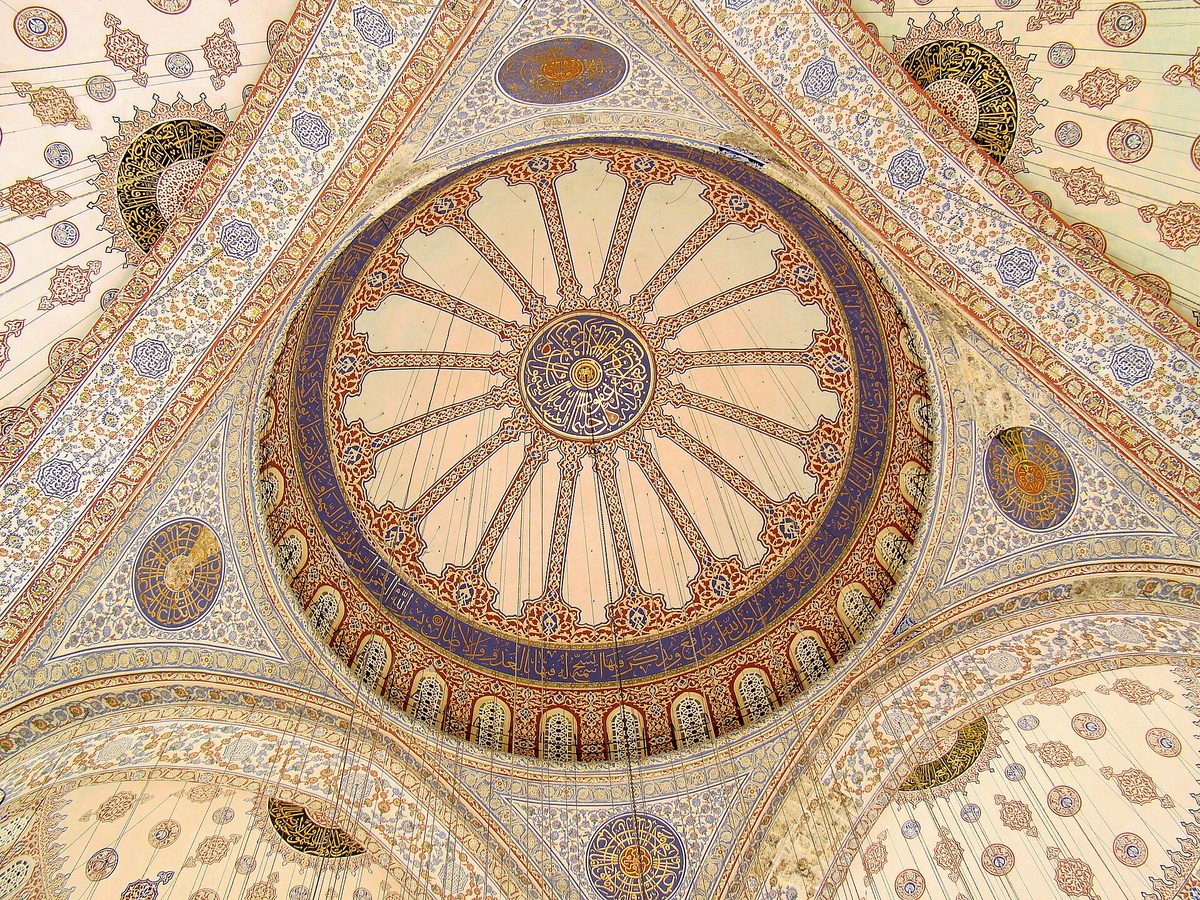 The painted central dome and pendentives of the Blue Mosque seen from below