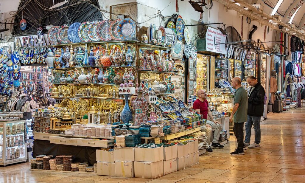 Ceramics and lamp shops lining a painted vaulted lane inside the Grand Bazaar, Istanbul