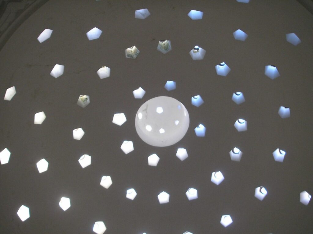 Star-shaped skylights piercing the dome of a historic Turkish bath in Istanbul