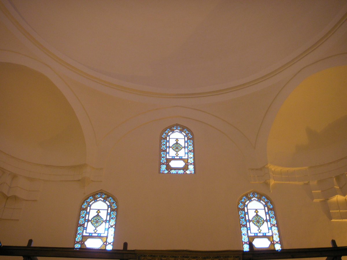 The domed interior of the Hurrem Sultan hamam in Istanbul with stained glass windows