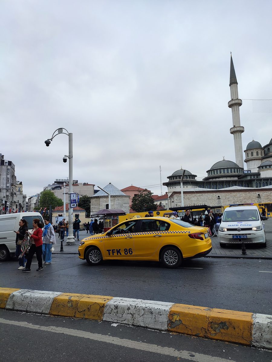 A yellow taxi in Taksim, Istanbul, one of the pricier transport options compared with the metro and ferries