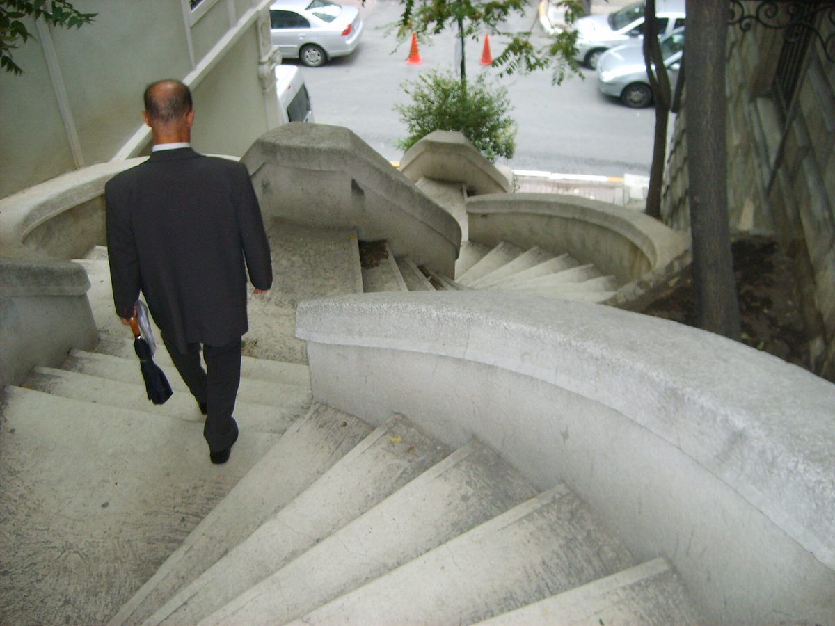 The curving double-helix Kamondo Stairs in Galata, Istanbul, with a man walking up