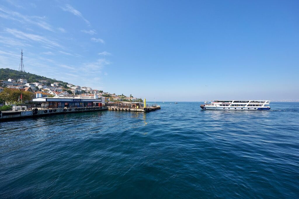 The harbour at Kinaliada in the Princes Islands with a ferry approaching across blue water