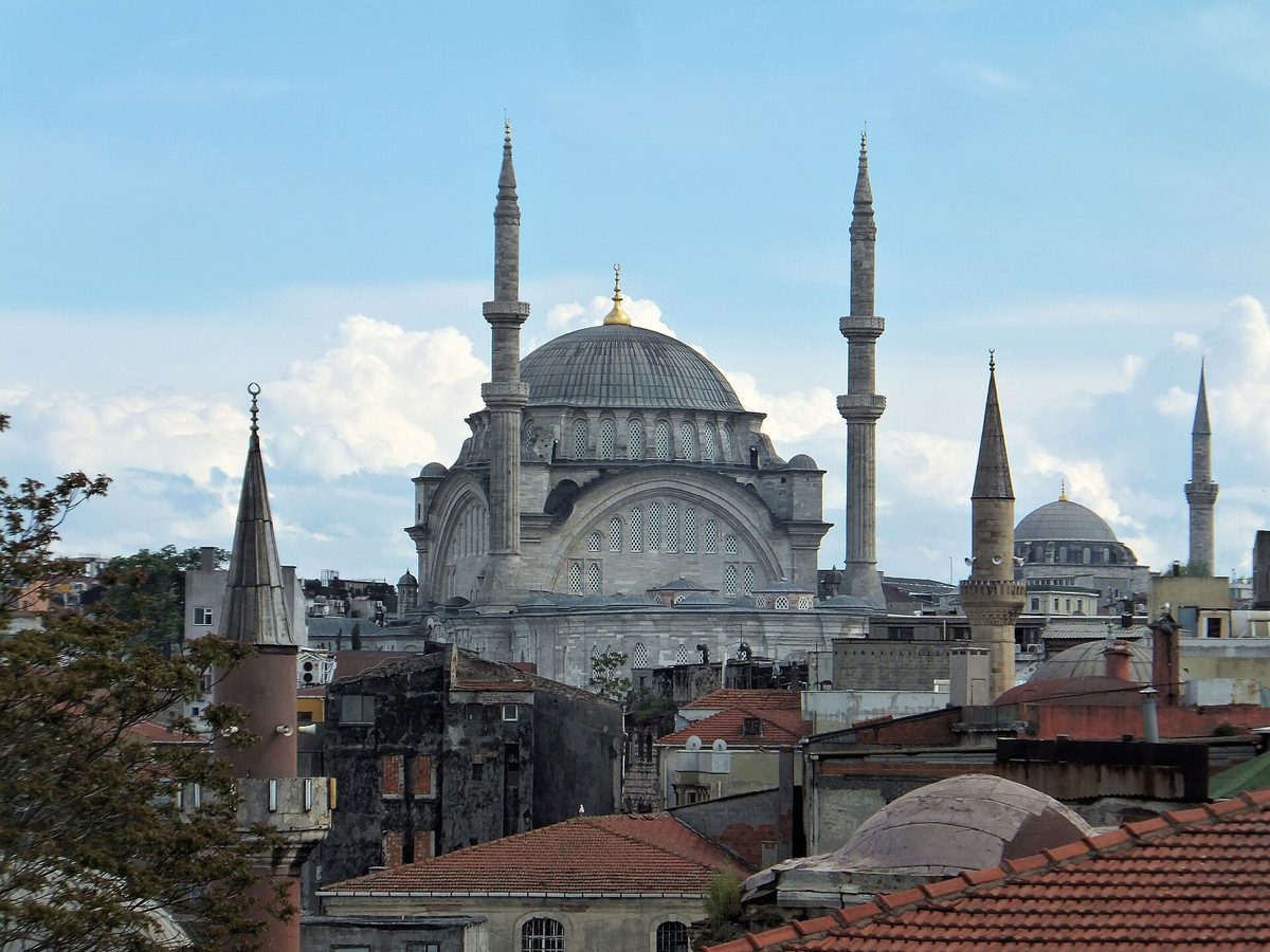 The domes and minarets of Nuruosmaniye Mosque rising over the tiled rooftops of the bazaar quarter