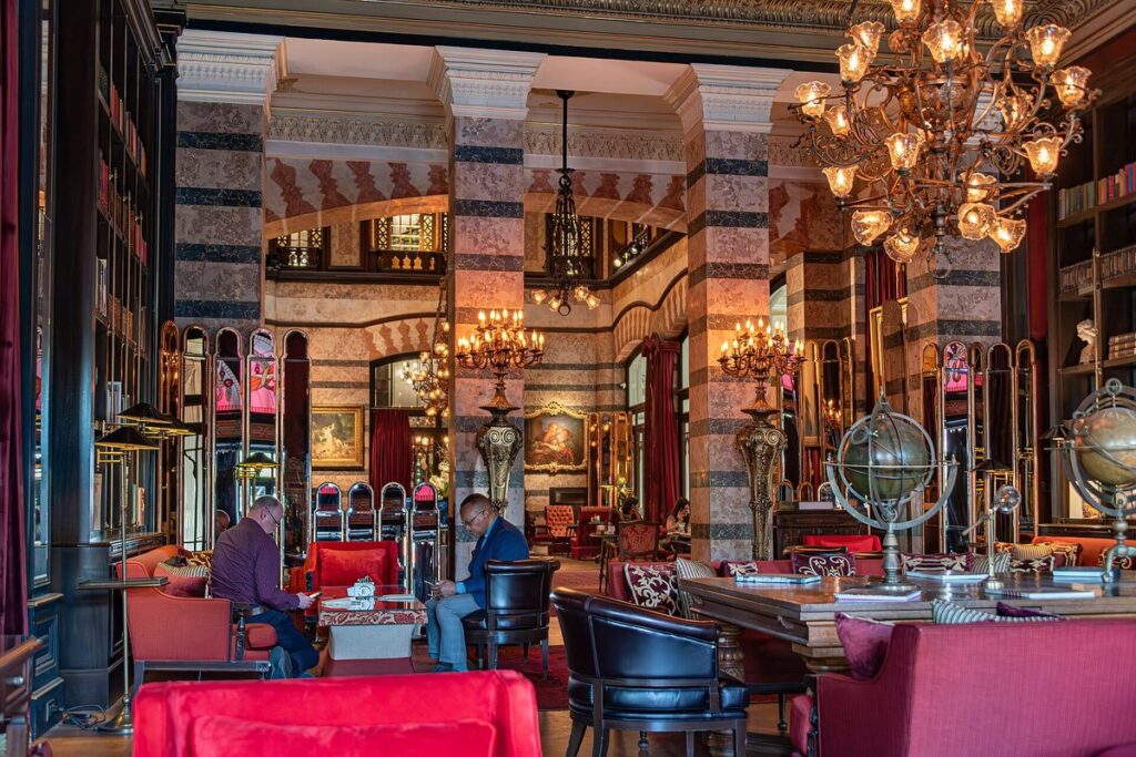 The striped arches and chandeliers of the Pera Palace Hotel saloon in Beyoglu, Istanbul