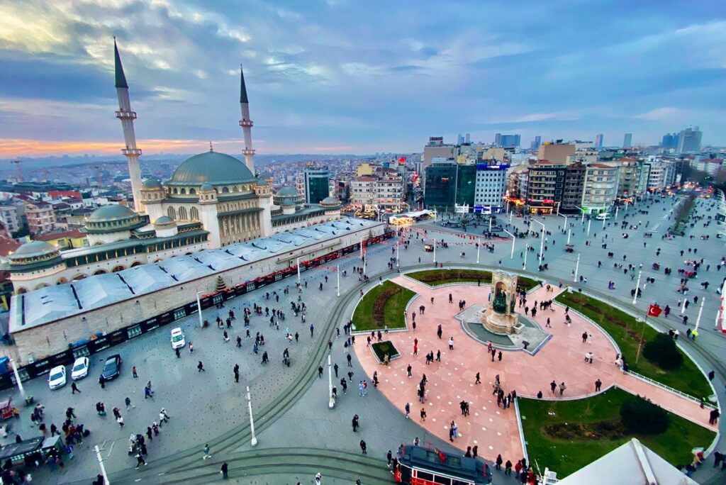 Taksim Square in Istanbul seen from above with the mosque, the Republic Monument and crowds