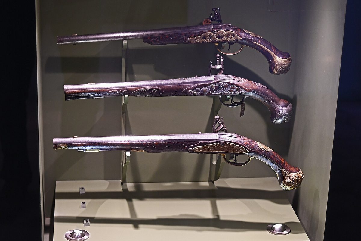 Ottoman flintlock pistols on display at the Turkish and Islamic Arts Museum in Istanbul, covered by the Museum Pass